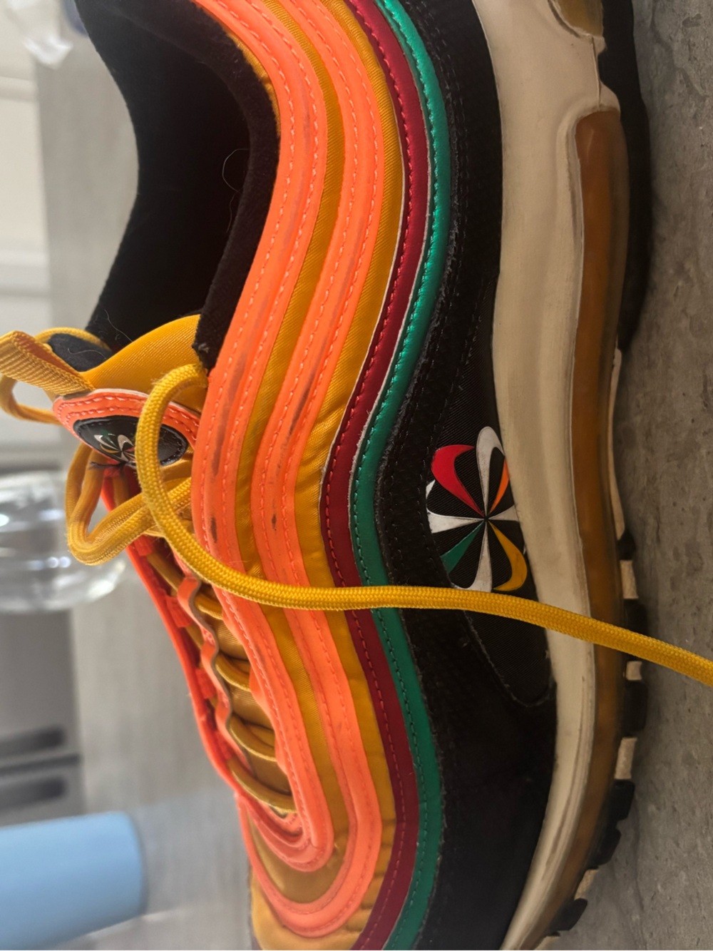 Nike men’s Colorwave Runner in Black with Orange, Yellow, Pink & Green Accents